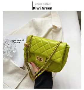 Detail of kiwi green quilted chain bag with gold twist lock and elegant texture