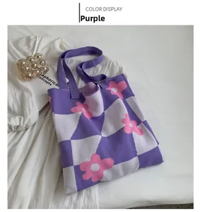 Detail of purple and white checkerboard knit tote bag with pink floral patterns