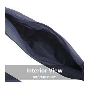Internal view of the dark blue nylon sling bag showing spacious main compartment