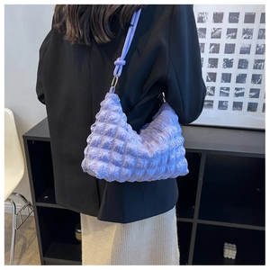 Close-up of purple bubble texture shoulder bag with stylish knot strap on shoulder