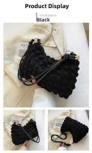 Detail of black shoulder bag with 3D bubble texture and zipper closure for casual style
