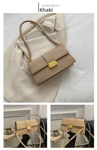 Detailed view of khaki crocodile pattern shoulder bag with golden square metal buckle