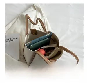 Detail view of large tote bag interior showing spacious storage with brown straps