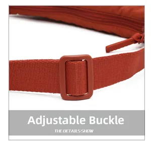 Detail of adjustable strap buckle on vibrant orange nylon crossbody dumpling bag