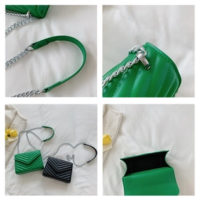 Close-up of bright green and black crossbody bags with classic chevron quilted texture