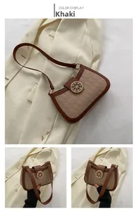Gros plan sur le sac matelassé kaki avec un fermoir doré vintage en forme de gouvernail