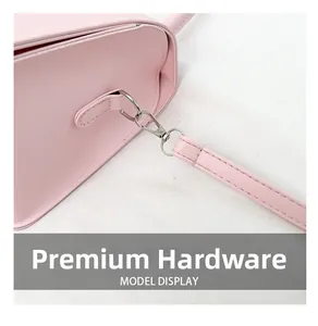 Close-up of premium silver hardware and pink PU leather stitching on a crossbody bag