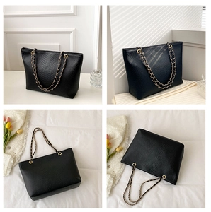 Detailed views of black tote bag featuring snakeskin texture and gold chain strap