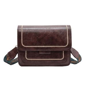 Vintage dark brown crossbody bag with floral stitching and retro patterned wide strap