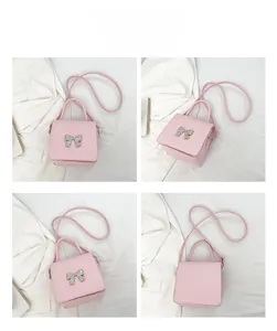 Multi-angle view of pink square crossbody bag with silver bow accent on white suit