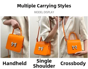 Orange mini square bag with silver bow detail showing three versatile carrying options