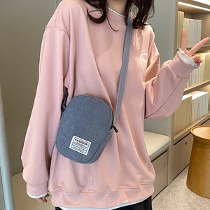 Women's dark grey corduroy crossbody bag with adjustable strap and casual design