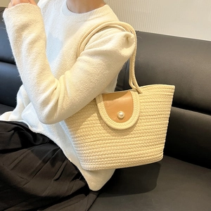 French style woven bucket bag in cream white with brown leather flap and pearl button
