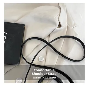 Detail showing comfortable black leather shoulder strap with smooth polished edges