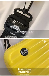 Detail of adjustable strap and vertical striped texture on yellow mini trunk bag