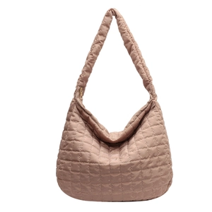 Quilted cotton padded tote bag in light brown showing a spacious hobo style design