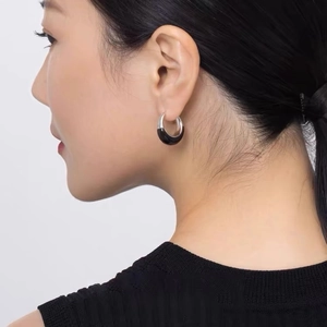 Minimalist silver hoop earrings with black enamel glaze finish for a modern female look