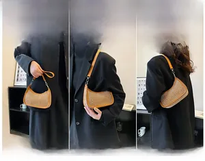 Orange crescent rhinestone bag shown in hand-held and shoulder-carry styles