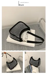 Detail view of black rhinestone crescent hobo bag featuring sparkling silver crystals