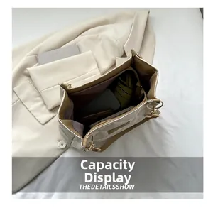 Quilted beige tote bag detail showing large capacity for laptops and wallets