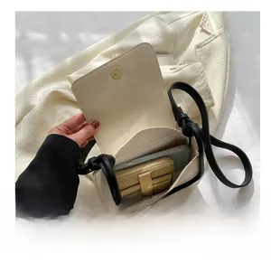 Interior view of the cream crossbody bag showing capacity for a phone and wallet