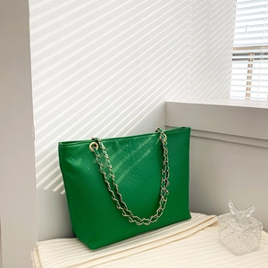 Green faux leather tote bag with snake skin pattern and gold chain shoulder straps