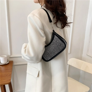 Sparkly rhinestone crescent shoulder bag for women with elegant black finish and silver studs
