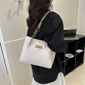 White quilted tote bag with FASHION label and gold chain strap for casual daily wear