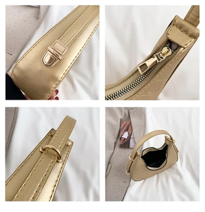 Detail of crocodile pattern PU leather and golden hardware on the crescent bag