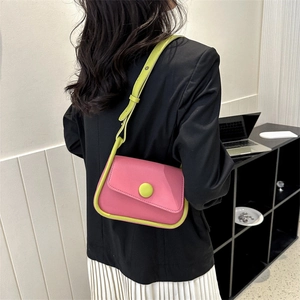 Modern pink and neon green contrast saddle bag with adjustable leather strap
