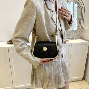 Stylish retro crossbody saddle bag with contrast trim on a model for casual look