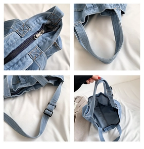 Detail view of large denim tote with top zipper, sturdy handles and adjustable strap