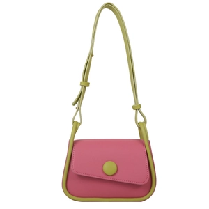 Modern pink and green color block saddle bag with a large circular buckle decoration