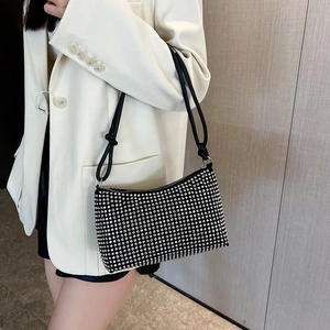 Fashionable black rhinestone shoulder bag with crystal embellishments and knotted strap detail
