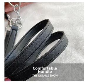Detail of comfortable black leather handle with silver metal rings and fine stitching