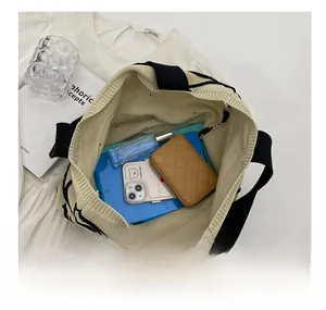Internal view of the large capacity knitted tote bag showing space for tablet and essentials