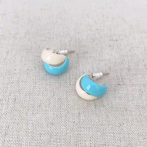 Minimalist cream and sky blue enamel C-shaped hoop earrings with silver pins