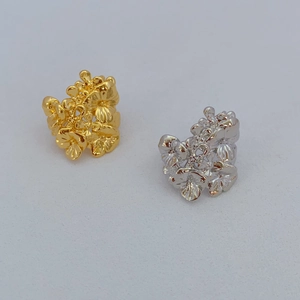 Floral cluster open rings in gold and silver finish with detailed flower petal design