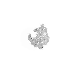 Close-up of a silver-toned floral cluster ear cuff with intricate layered metal petals