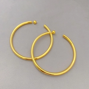 Fashionable C-shaped hollow gold-plated hoop earrings with smooth metallic finish