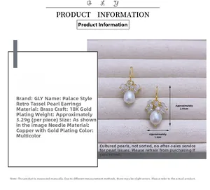 Detail view of drop pearl earrings with brass gold plating and size measurements