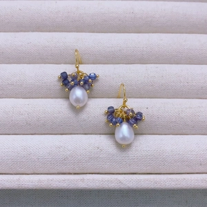 Handmade gold drop earrings featuring white pearls and blue natural crystal stone beads