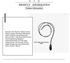Detail of tear-drop black agate pendant with 18K gold-plated brass edge and leather cord