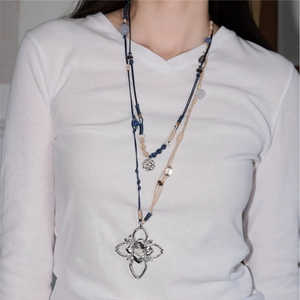 Bohemian multilayer woven cord necklace with hollow gold-plated pendant and beads