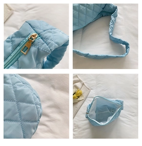 Detailed views of light blue quilted nylon shoulder bag with zipper and inner lining