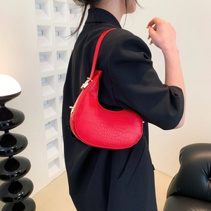 Vibrant red faux crocodile crescent underarm bag with gold metal buckle hardware