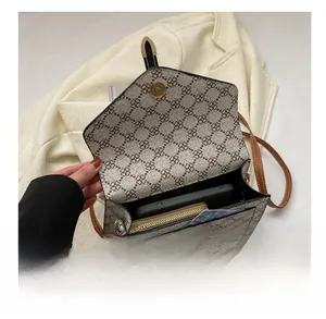 Top view of vintage flap bag interior showing capacity for phone, wallet and cards