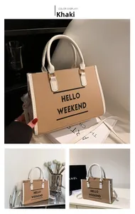 Détail du sac cabas kaki avec texte HELLO WEEKEND et finitions contrastées blanches