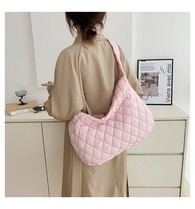 Detailed back view of pink quilted hobo bag with classic diamond stitch pattern