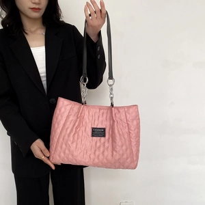Quilted nylon tote bag in pale pink with chain strap for casual women shoulder wear